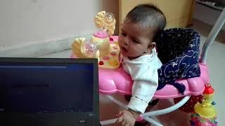 6 months old baby .....playing with laptop