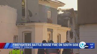 Firefighters battle house fire on south side