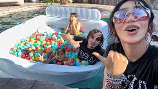 WE MADE A HUGE BALL PIT IN THE POOL!!