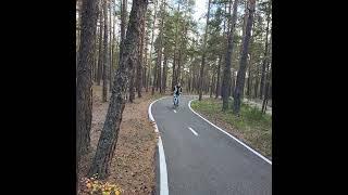 Rustem Yermekbayev and Zulfira Tazetdinova riding bikes in Burabay.