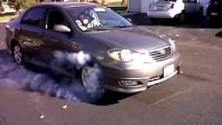 2005 Toyota Corolla burn old tires.