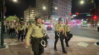 Police stage outside federal courthouse after night of unrest in Downtown Las Vegas