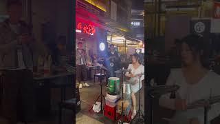 Chinese female drummer bucket drums, street performance