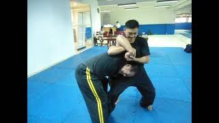 Mano-mano to Dumog: Block to rabbit punch to wristlock