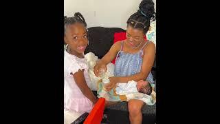 Muna bounding with her newborn baby brother
