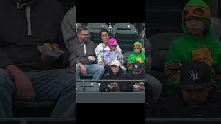 Kid in turtle costume gets foul ball and THROWS IT BACK!! 