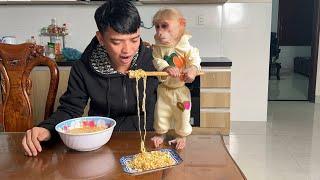 Thang and Luk prepare a simple breakfast together