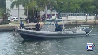 Woman fighting for her life after being pulled from Miami River; man detained