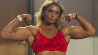 Teen muscle girl flexing big biceps