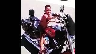 Zifi riding a big hog motorcycle