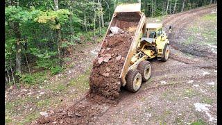 Putting down roadbase rock