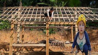 Vietnamese single mother completes roof on rainy day