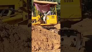 Khmer construction, Buldozer pushing soil in Cambodia village