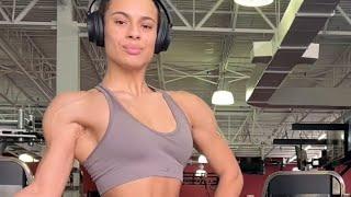 Beautiful muscular woman flexing muscles