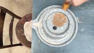 Granite Hand-Mill or Quern Stone Mill Demonstration - grind flour the old way