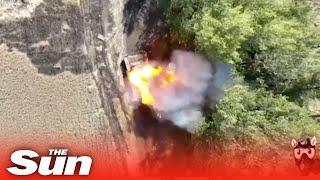 Ukrainian drone drops bomb into Russian tank open hatch with precision