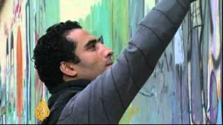 Artists use graffiti to tell Egypt revolution's stories