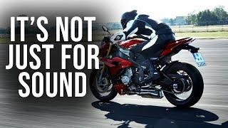 Why do motorcycle riders blip the throttle?