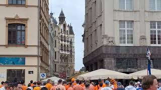 Dutch fans on the Marketsquare in Leipzig with a football