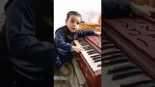 Amazing | Funny | talented child playing harmonium