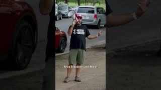 Tesla FSD fails to stop at a robotaxi protest in Austin