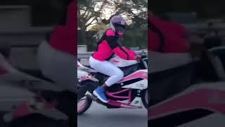 Pinky Bling rides  out on her Kawasaki 650 motorcycle.