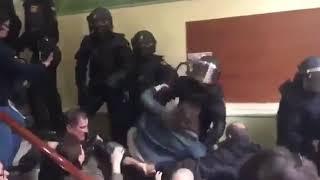 Catalonia. People are thrown off the stairs and kicked