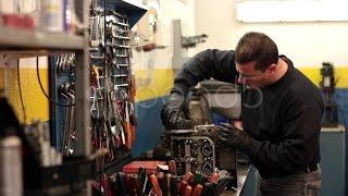 Auto Mechanic Repairing A Part Of A Car Engine. Stock Footage