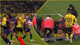 Dortmund’s Nico Schlotterbeck taken off on stretcher with ankle injury in loss to Barcelona