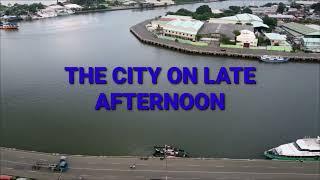 Late afternoon flight over the city of Iloilo.