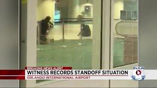 Witness records standoff at Orlando International Airport