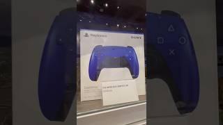 The Google Chromecast with Google TV and a blue PlayStation five controller at the arcade ￼￼￼