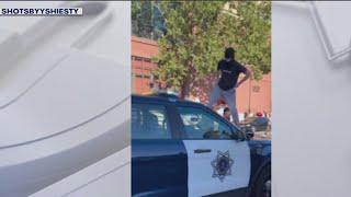 Masked spectators stomp, attack San Jose police car after sideshow | KTVU