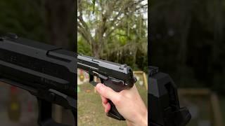 How do you decock a USP Compact pistol? [drop hammer without firing]