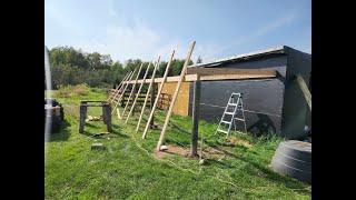 Almost a Farmstead. Melissa is in Louisiana. Building a lean to for wood storage. Milk cooler.