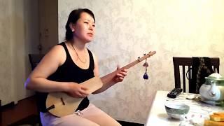 Beautiful Singing Kyrgyz Woman Entertains with Komuz with National Instrument