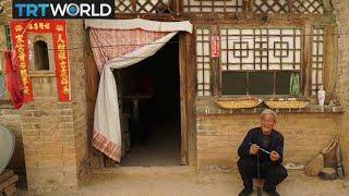 China Caves: Cave dwellers reluctant to move to new homes