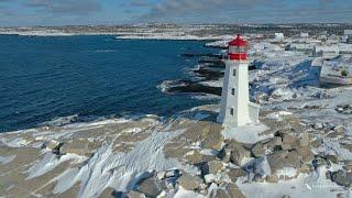 Capturing the Charm of Peggy's Cove Lighthouse in Winter - A Stunning Drone Video