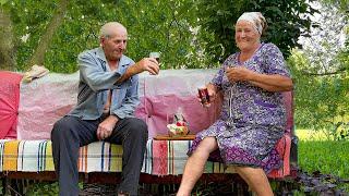 Hard daily work of an elderly couple in a mountain village far from civilization