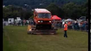 VW LT40 4x4 driving over a container and some timber