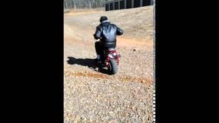 My brother Forest's minibike throwing dirt.