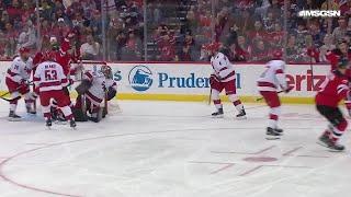 Dougie Hamilton scores a goal against the Carolina Hurricanes