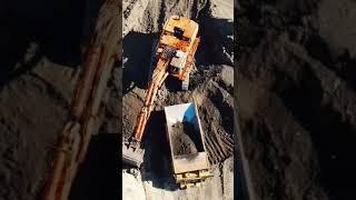 Large Hydraulic Excavator digging and scooping dirt into dump truck #postmymachine