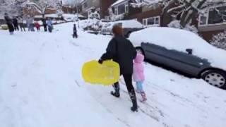 Sledging down a snowy street