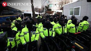 Police surround impeached South Korean president's residence as arrest warrant issued