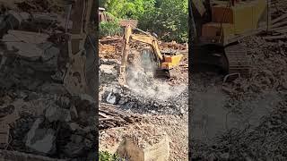 Demolition of dilapidated buildings using heavy machinery construction process