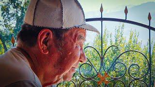 An elderly couple in the village of Tau Turgen in Kazakhstan. Cleaning the yard, preparing kespe.