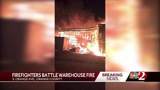 Orange County firefighters battling fully-involved warehouse fire