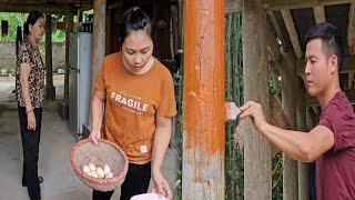 The storm lasted for a long time so Ly's family stayed home together: Painting the house pillars.