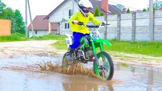 Brothers ride motorcycles through large puddles